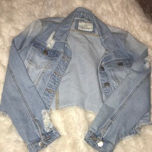 Light wash distressed jean jacket.